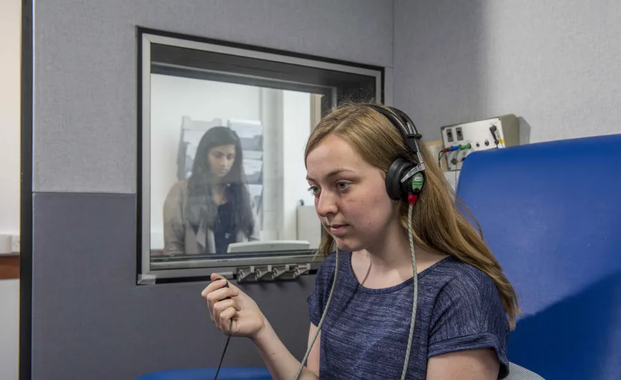 2 students conducting a hearing test.