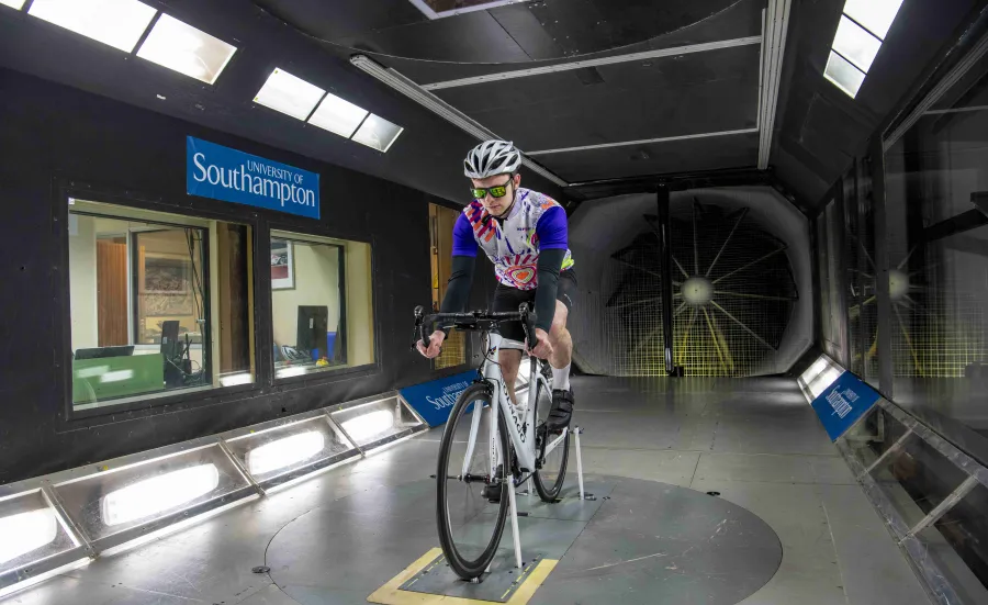 Cyclist takes part in an aerodynamics experiment in the R J Mitchell wind tunnel