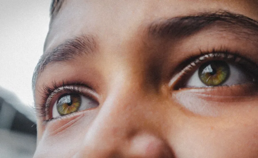 Close up of a young person's eyes looking into the distance
