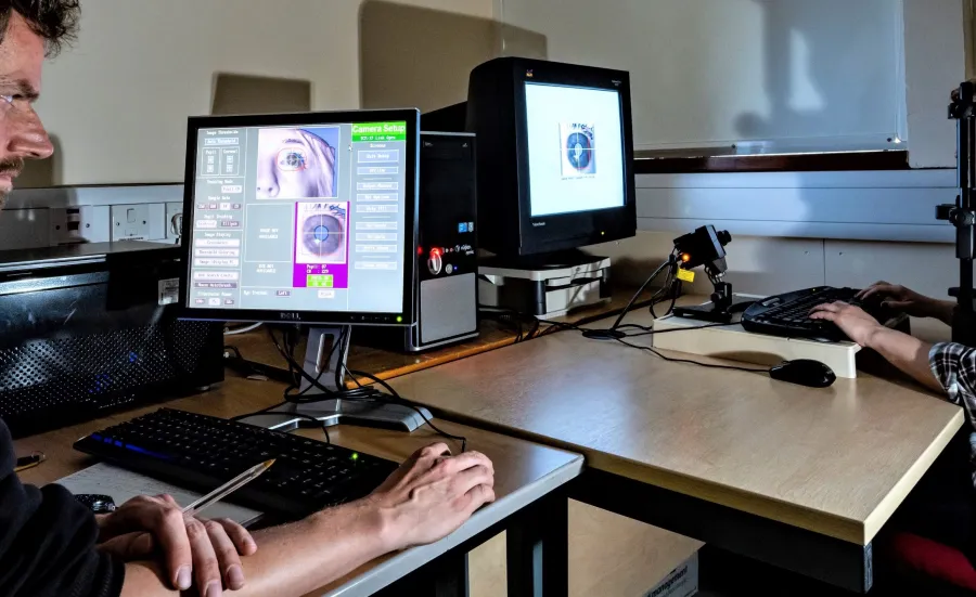 A University researcher uses an eye-tracker device to record and analyse eye movements of a research participant