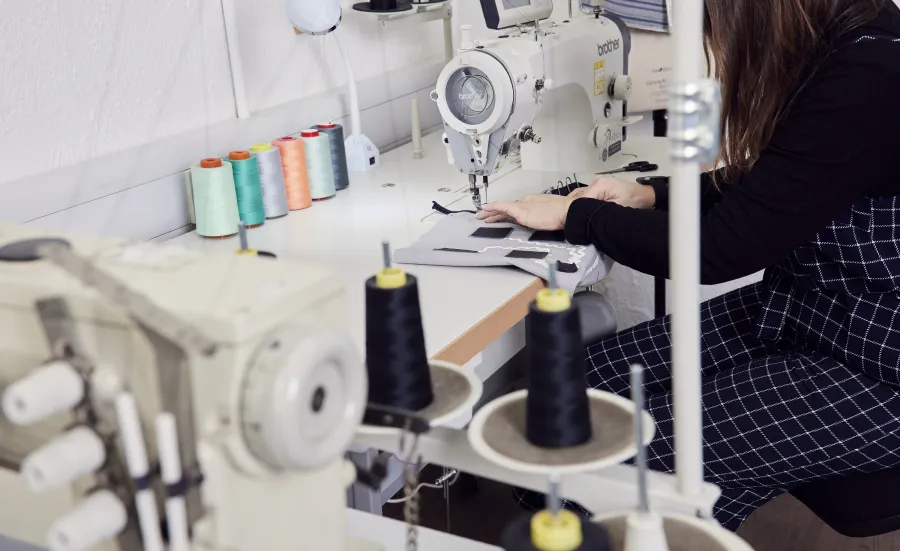 Woman using an industrial sewing machine
