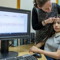 A study participant is prepared for a facial electromyography experiment